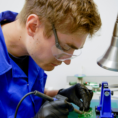 Stuart Thomas working on a circuit board
