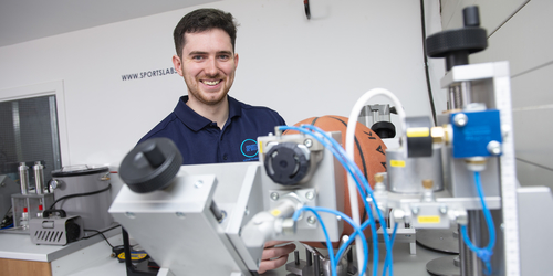 Mechanical Engineering student Thomas working with equipment in the Sports lab.