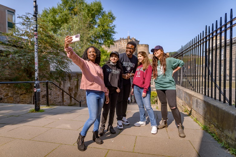 Edinburgh Napier students next to Edinburgh Castle