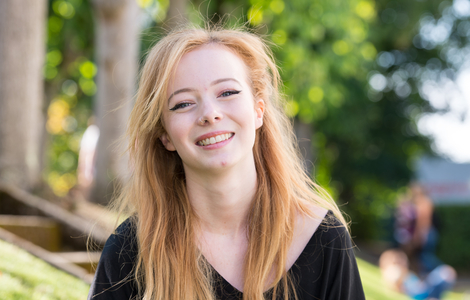 Female student smiling for the camera at Freshers' Fair