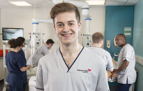 Male nursing student smiling for the camera