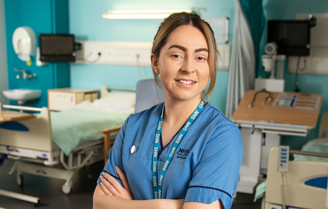 A female nursing student standing in a hospital