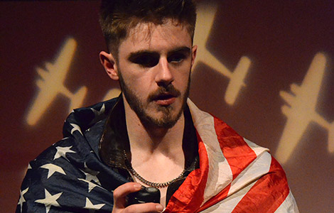 Student actor wrapped in a USA flag