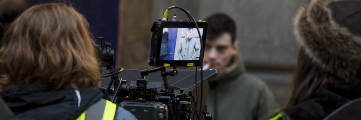 Film students working on location with camera equipment around the High Street in Edinburgh