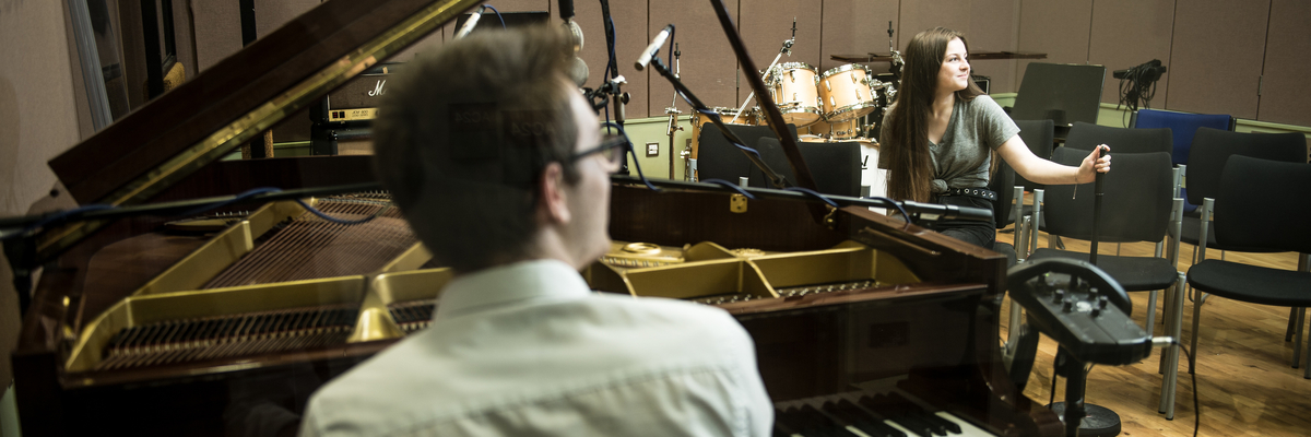 students in a music recording studio