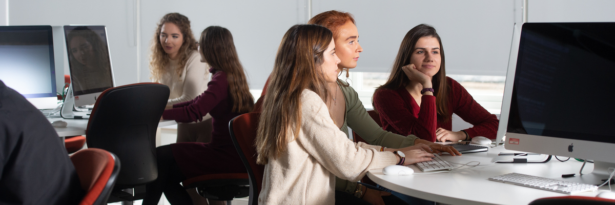Female students working together on computers