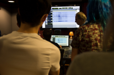 teacher and student listening to sound waves