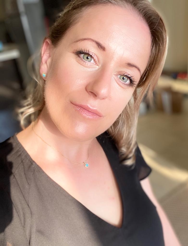 Rebecca Gates looking into the camera, smiling 