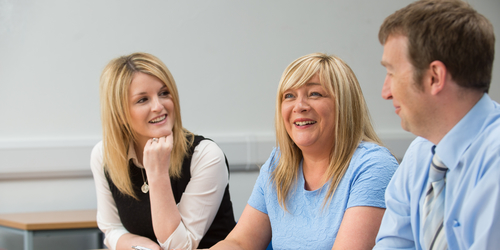 Three members of the Careers Team chatting in a meeting