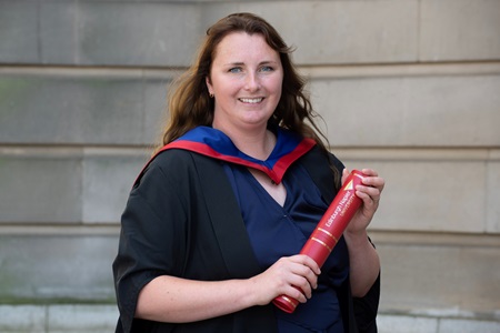 Kirsty Dow standing outside the Usher Hall with her degree