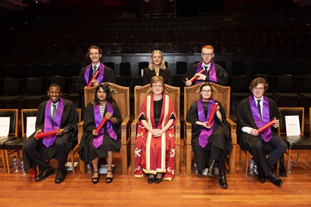 The cohort from Enable's Breaking Barriers programme on stage at the Usher Hall with Edinburgh Napier University Principal Andrea Nolan