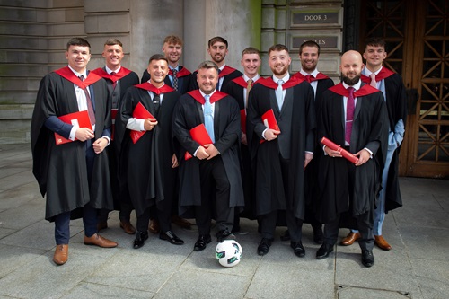 The first group of Football Coaching, Performance and Development graduates posing outside the Usher Hall