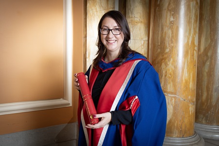 Angela Grahame standing with her honorary degree