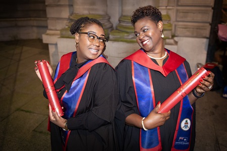 Kerry-Ann and Edwina with their degrees outside the Usher Hall