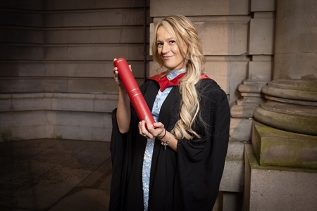 Laura McAuley with her degree outside the Usher Hall