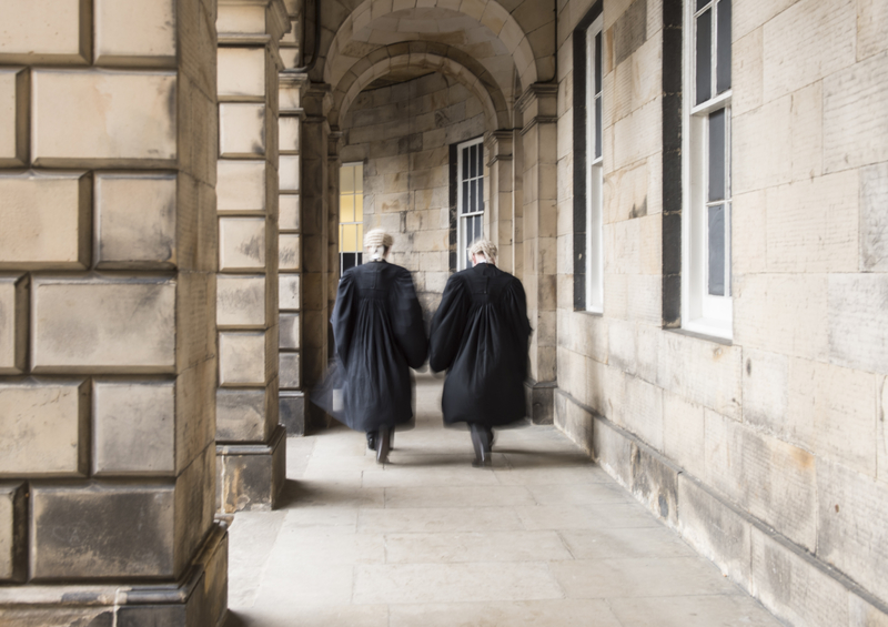 Courtyard with lawyers walking. 