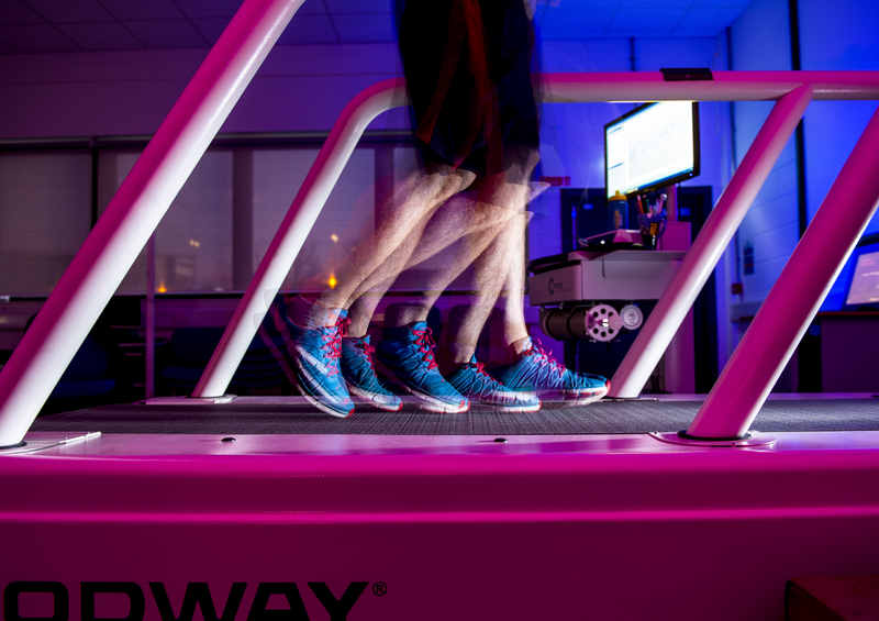 Close up of a person on a treadmill.