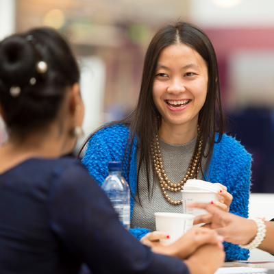 Two female students lauging together