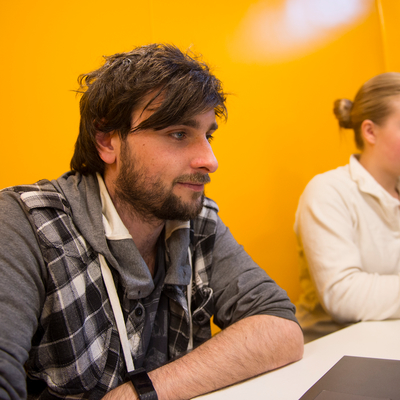 Male student studying in library