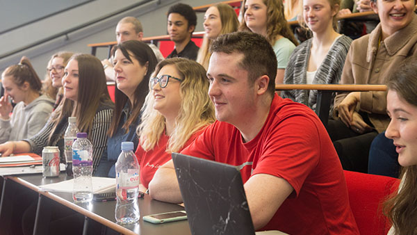 students watching a lecture in class