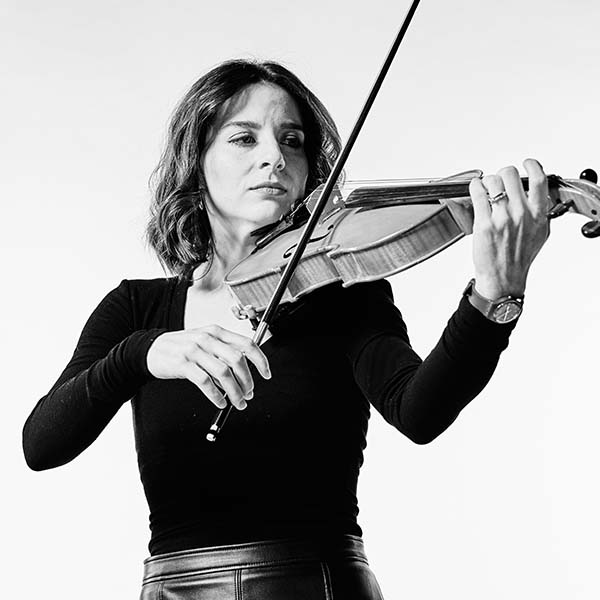 professional violinist and PHD student arianna confidently plays her instrument
