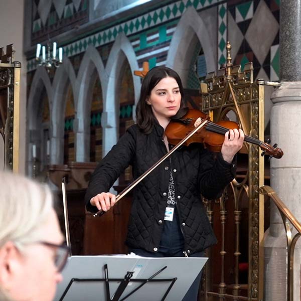 phd student arianna teaches adult music class in rural community church