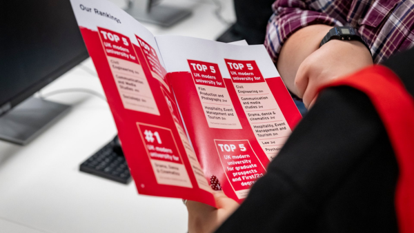 student looking at prospectus